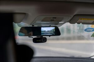 dash cam on the dashboard of a car that is moving on highway
